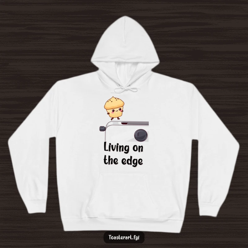 Funny kawaii muffin precariously on a toaster edge, a cozy and humorous hoodie design.
